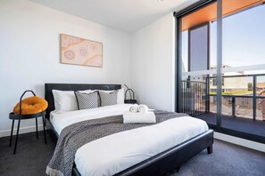Comfortable queen-sized bed with view in the bedroom