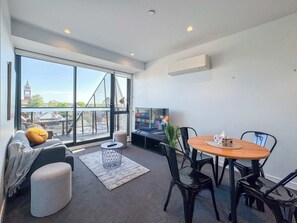 Cozy living room with 4 seat dining table