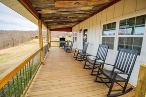 This porch offers breathtaking views and a welcoming atmosphere. A perfect blend of old and new.