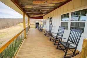 This porch offers breathtaking views and a welcoming atmosphere. A perfect blend of old and new.