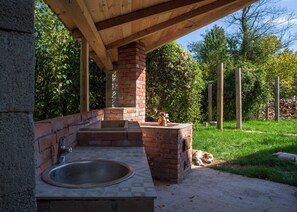 BBQ facility in big terrace behind our cabin