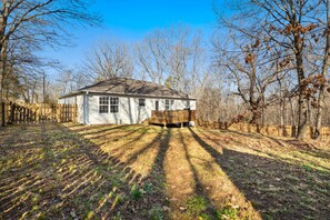 At home enjoy amenities for 7 in our 3-bedroom, 2-bathroom home including a fully stocked kitchen, cozy living room, and large fenced in back yard with seating - perfect to bring the dogs along!