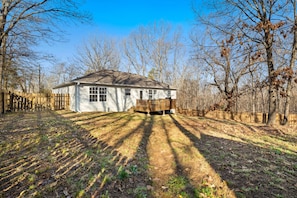At home enjoy amenities for 7 in our 3-bedroom, 2-bathroom home including a fully stocked kitchen, cozy living room, and large fenced in back yard with seating - perfect to bring the dogs along!