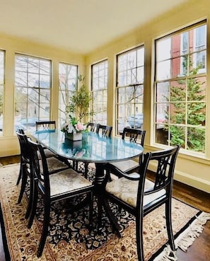 Beautiful three season sunroom off of kitchen for morning breakfast