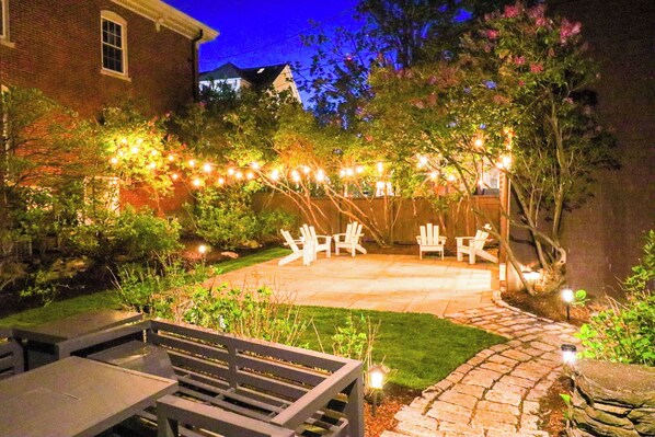 Private garden patio seating with fire table