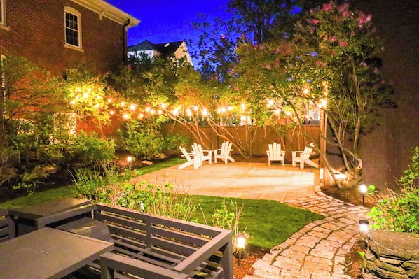 Private garden patio seating with fire table