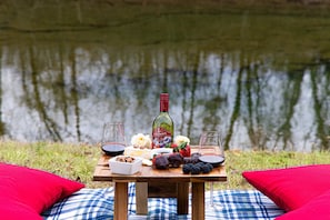 Looking for a break from all your adventures? Grab our outdoor picnic blanket & wine table to create the perfect creekside picnic.