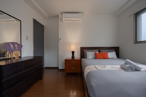 A beautifully designed bedroom blending modern comfort with vintage charm