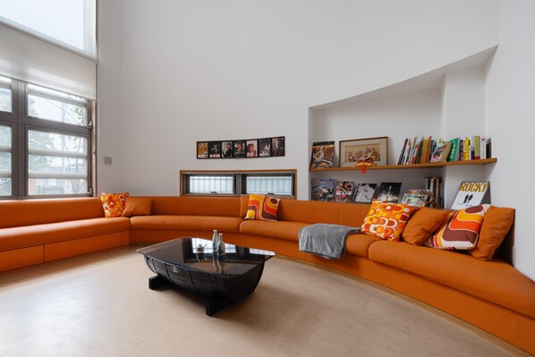 A spacious, light-filled living area where design meets comfort—perfect for families and groups