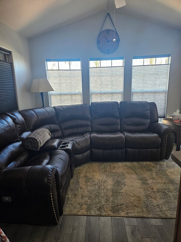 Sectional with 3 recliners. Upgraded paint and light filtering cellular shades.