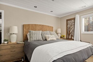 Master Bedroom featuring a king-size bed and luxurious linens.