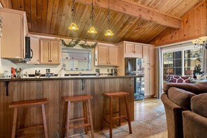 Bar seating for up to three at the kitchen bar area.