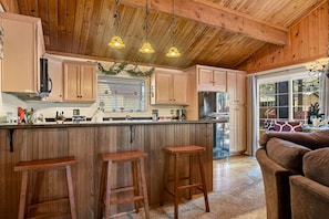 Bar seating for up to three at the kitchen bar area.