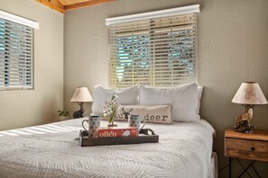 Master bedroom featuring a queen size bed.