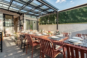 Outdoor rooftop terrace with plenty of seating, ideal for group gatherings