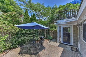 Patio surrounded by lush vegetation, providing a rare secluded outdoor oasis