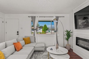 Large living room window for excellent natural lighting.