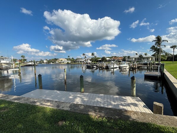 View from patio overlooking private dock and harbor