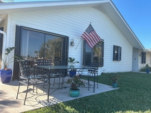 Patio and side of house facing water