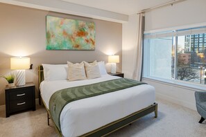 Designer bedroom with original local art and 55" Roku and Direct Tv