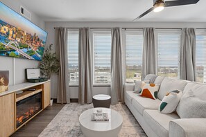 Bright and airy living space designed for relaxing — kick back, catch a view, or unwind with a vinyl spin.