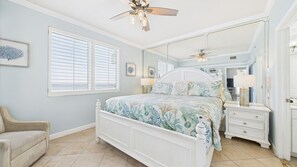 Master bedroom with king bed TV and ensuite bathroom