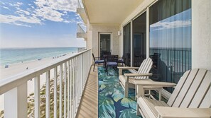 Wrap around balcony with seating and coastal views and resort views