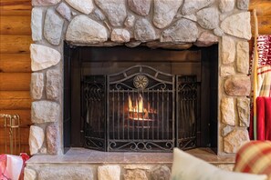 Curl up with loved ones while enjoying the warmth of a wood burning fireplace