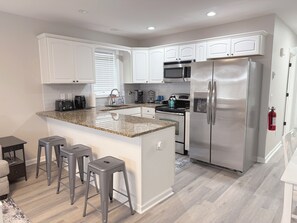 Full kitchen with fridge, microwave, oven, stove, dishwasher, etc.