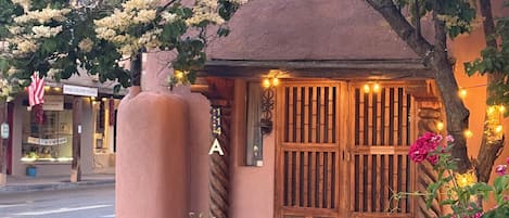 Historic adobe entrance, steps from the Plaza