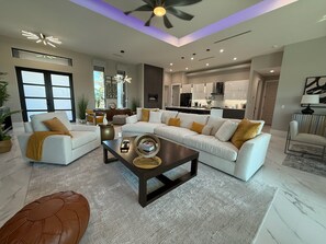 Large open living room with TV and fireplace.