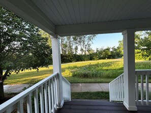 Summer view from of porch with the Harbor Shores path a few feet away.