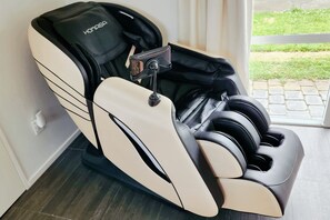 massage chair in King Size bedroom