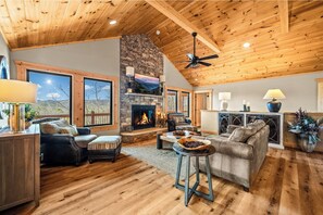 Natural light pours into the living room, creating a warm and welcoming cabin. 