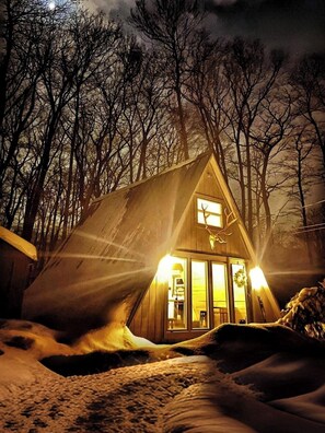 At night, our A-Frame turns into a magical cabin of romance hidden in the enchanted woods