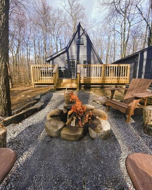 Light up your retreat enjoyment with our rustic fire pit in the secluded woods
