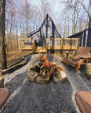 Light up your retreat enjoyment with our rustic fire pit in the secluded woods