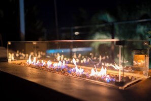 At night, the firepit becomes the focal point of the backyard.