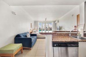 Kitchennete wil dishwasher, and stainless steel feucet, hallway with sofa bed