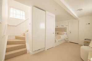 Bedroom with staircase leading to the living room