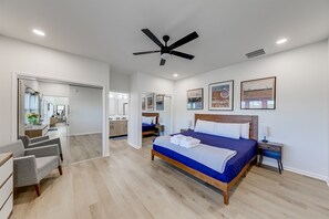 Master bedroom with king bed and mirrored closet