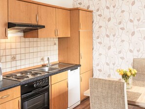 Furniture, Interior Design, Wood, Flooring, Floor, Cabinetry, Kitchen, Sink, Lighting, Countertop