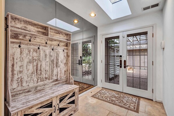 Architectural Elegance Meets Natural Beauty: Designed by Joe Hall, this exquisite courtyard house offers a seamless blend of luxury and nature, with sweeping marsh views and lush gardens surrounding every room.