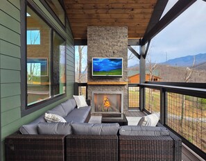 Bearfoot Lodge's outdoor seating area with fireplace