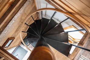 Spiral leads to both Queen bedrooms and full bath, laundry 2nd floor