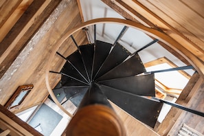 Spiral leads to both Queen bedrooms and full bath, laundry 2nd floor