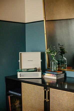 A touch of nostalgia, with a record player and thoughtful décor adding warmth and character to the space.