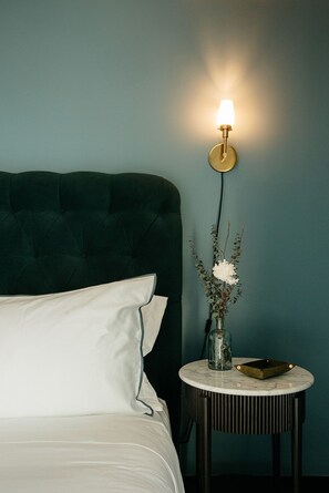Elegant bedside ambiance, where soft lighting and minimalist details enhance relaxation.