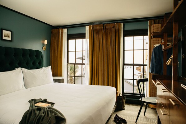 Refined comfort in a beautifully curated room, blending deep hues, soft textures, and timeless elegance.