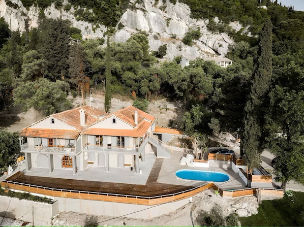 Our propertys building with the communal swimming pool